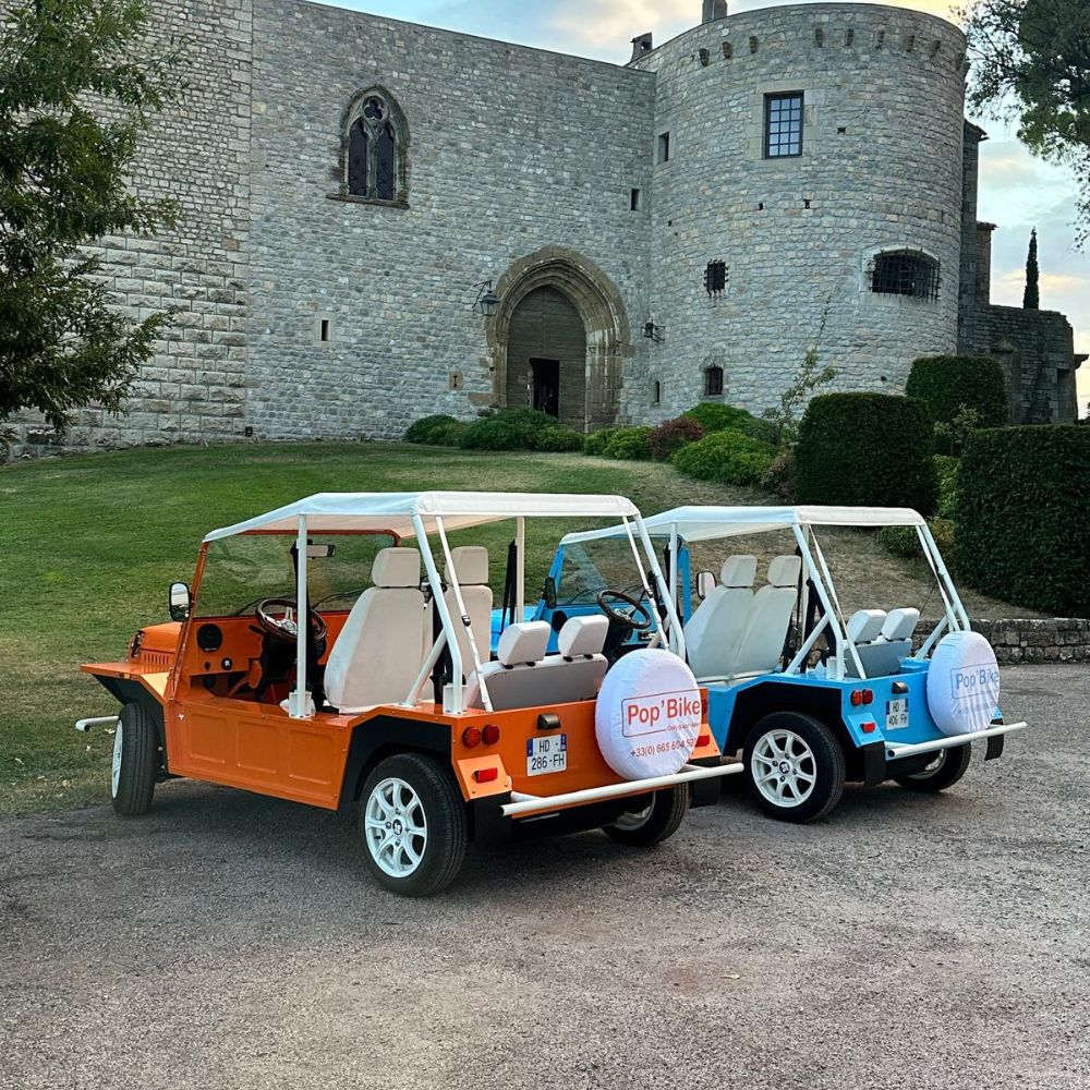 Blue and orange Mini Moke in the Provençal hinterland